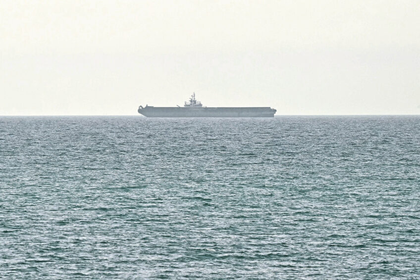A ship is seen off the coast of Ras al-Khaimah, the day after the breakdown of US-Iran peace talks on April 13, 2026. Photo: AFP